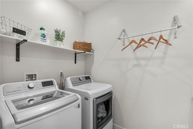 washroom featuring laundry area and independent washer and dryer