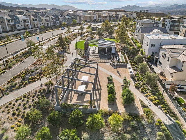 birds eye view of property with a mountain view and a residential view