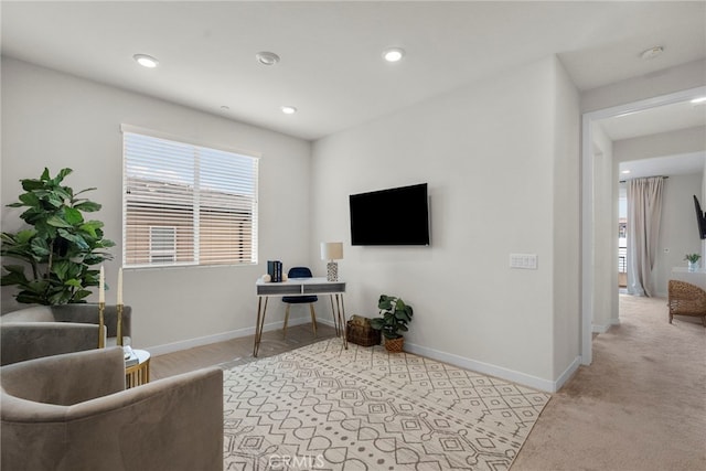 office space with light carpet, baseboards, and recessed lighting