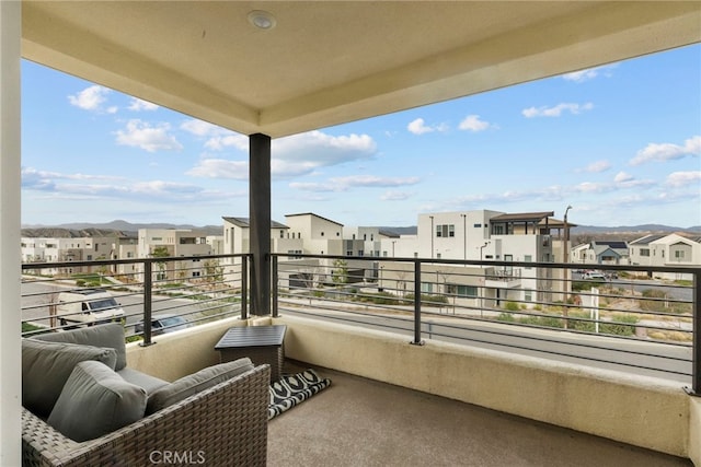 balcony featuring a residential view