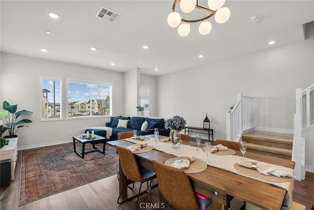 dining room featuring stairway, wood finished floors, visible vents, and recessed lighting