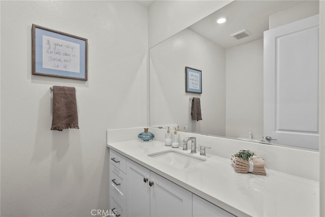 bathroom with visible vents, vanity, and recessed lighting