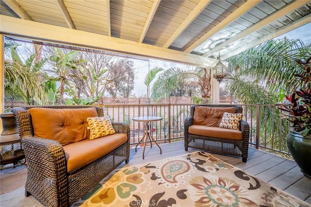 sunroom with lofted ceiling with beams