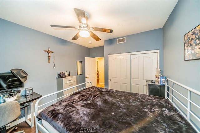 bedroom featuring a closet, visible vents, and ceiling fan