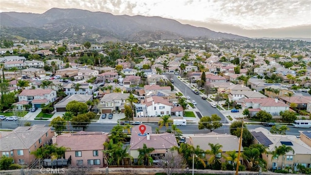 drone / aerial view featuring a mountain view and a residential view