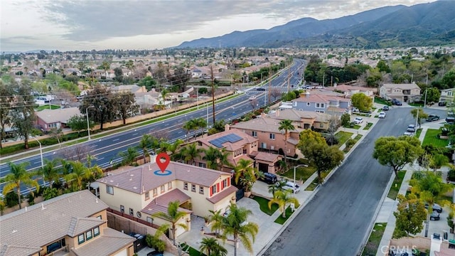 birds eye view of property featuring a mountain view and a residential view