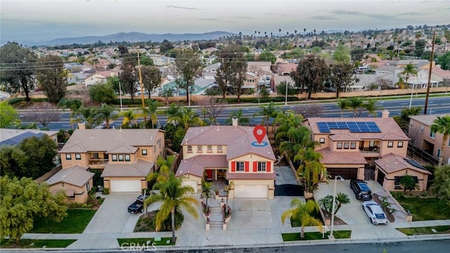 bird's eye view featuring a mountain view and a residential view