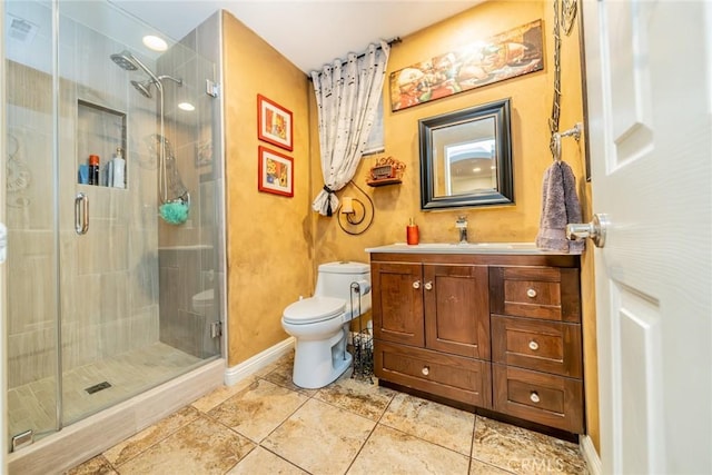 full bath featuring tile patterned flooring, toilet, vanity, baseboards, and a shower stall