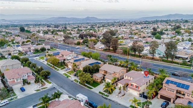 drone / aerial view with a residential view and a mountain view