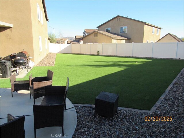 view of yard featuring a patio and a fenced backyard