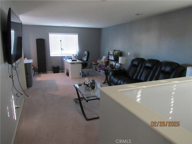 living room featuring light colored carpet