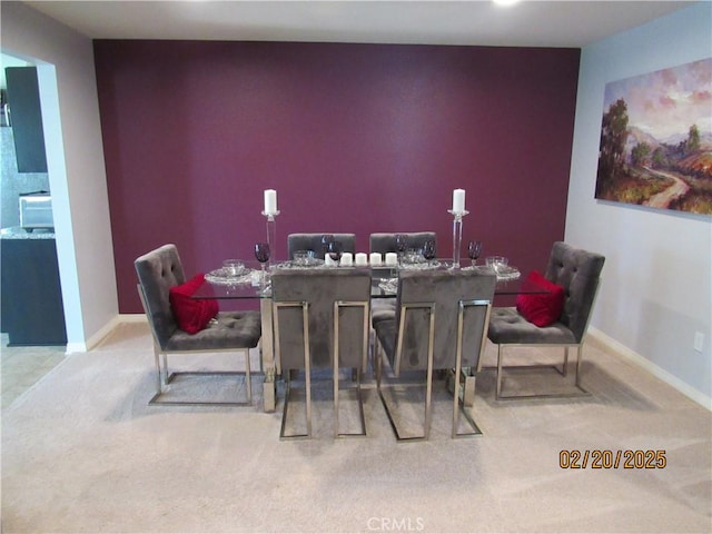 bar featuring baseboards and carpet