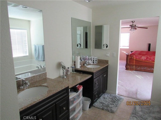 full bathroom with connected bathroom, ceiling fan, a tub to relax in, tile patterned floors, and vanity