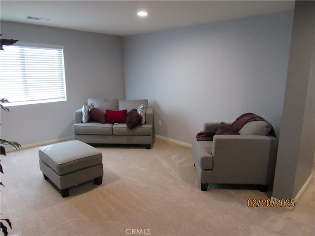 interior space with visible vents, recessed lighting, light colored carpet, and baseboards