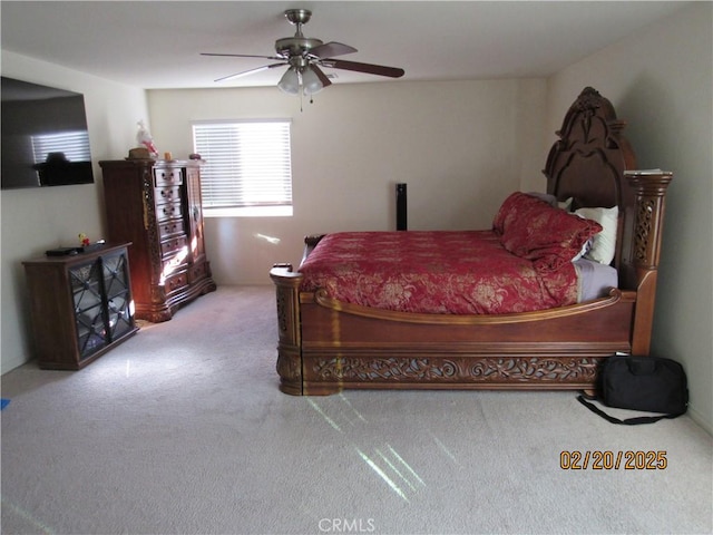 carpeted bedroom featuring a ceiling fan