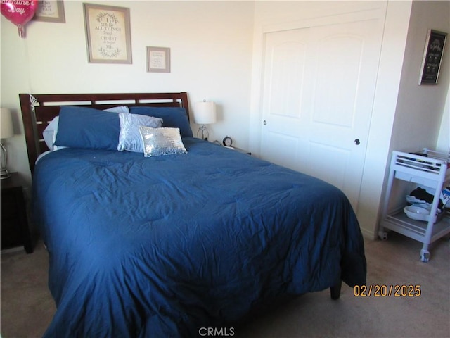 bedroom featuring a closet and carpet