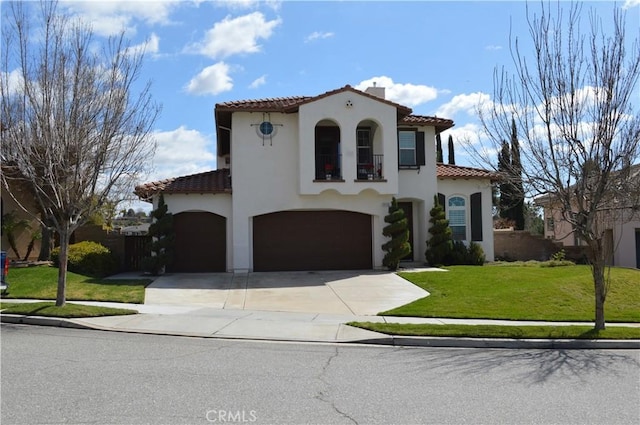 mediterranean / spanish-style home featuring a tile roof, a balcony, a front lawn, and stucco siding