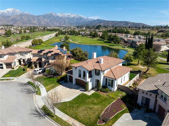 bird's eye view featuring a residential view and a water and mountain view