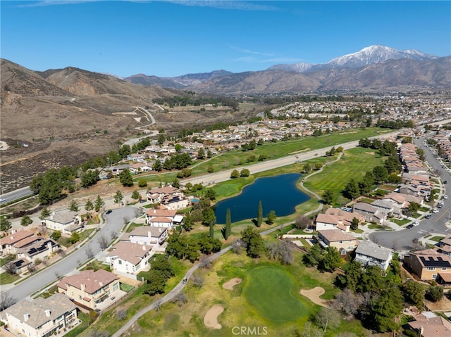 drone / aerial view featuring a residential view and a water and mountain view