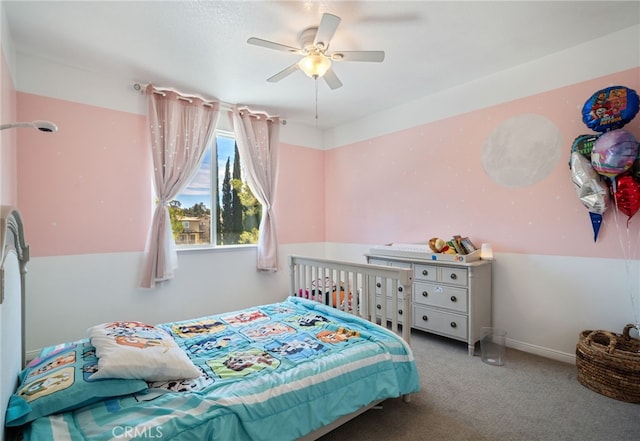 bedroom featuring a ceiling fan, carpet, and baseboards