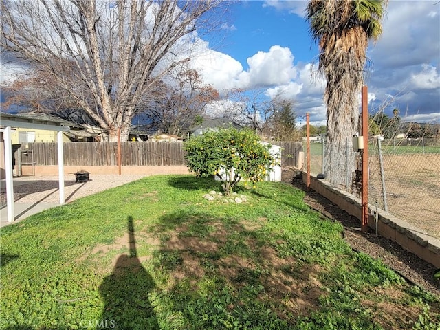 view of yard with a fenced backyard