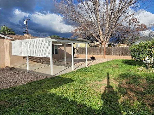 view of yard with a patio area and fence