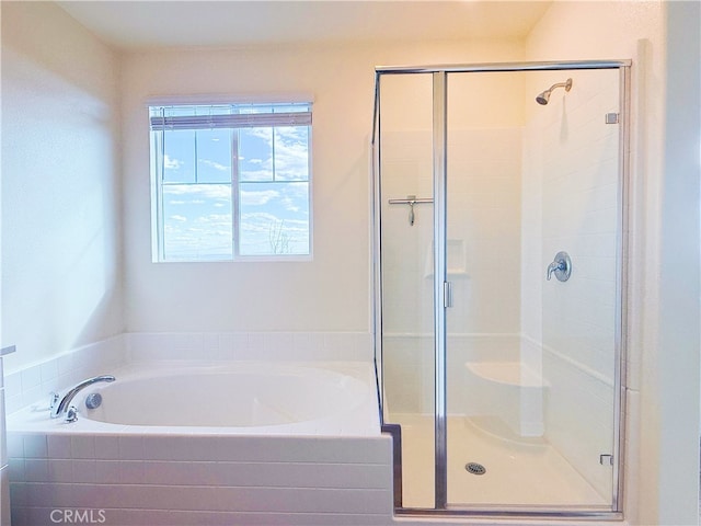 full bath with a garden tub and a shower stall