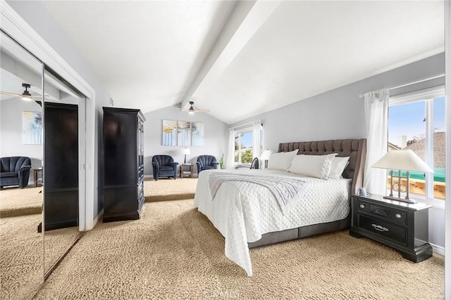 bedroom with light carpet, lofted ceiling with beams, multiple windows, and baseboards