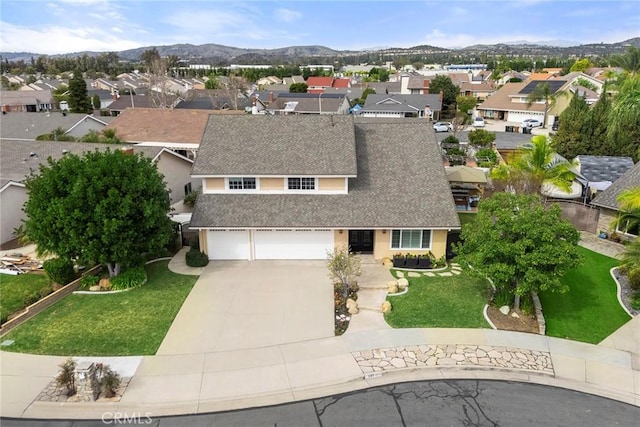 drone / aerial view featuring a mountain view and a residential view