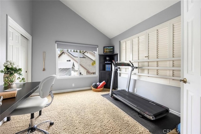 workout room featuring high vaulted ceiling, carpet flooring, and baseboards