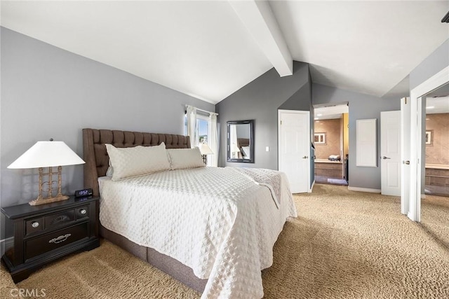 bedroom featuring carpet floors, connected bathroom, vaulted ceiling with beams, and baseboards