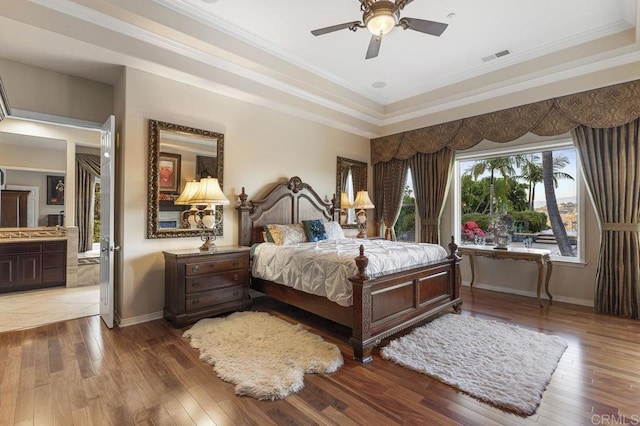 bedroom featuring hardwood / wood-style flooring, baseboards, and visible vents