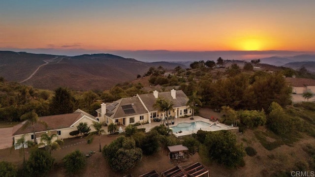 birds eye view of property with a mountain view