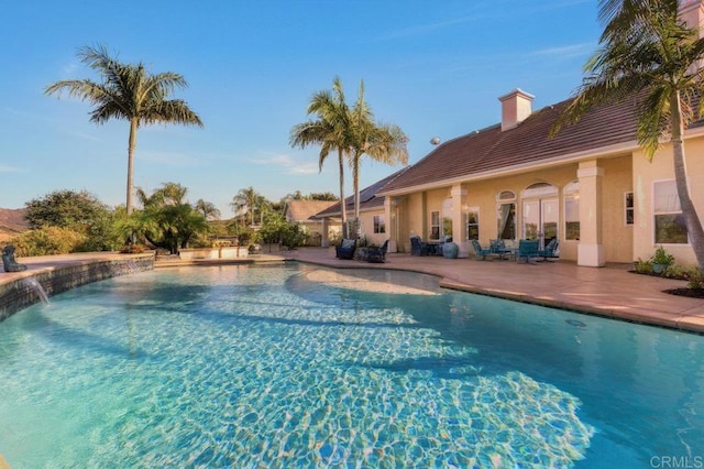 pool featuring a patio area