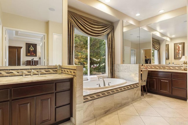 full bathroom featuring tile patterned flooring, a garden tub, two vanities, and a sink