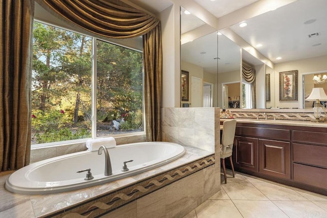 bathroom featuring vanity, a garden tub, and visible vents