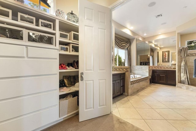 full bathroom with a bath, visible vents, tile patterned flooring, and vanity