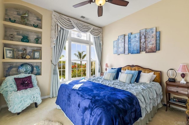 bedroom with visible vents, baseboards, a ceiling fan, and carpet floors