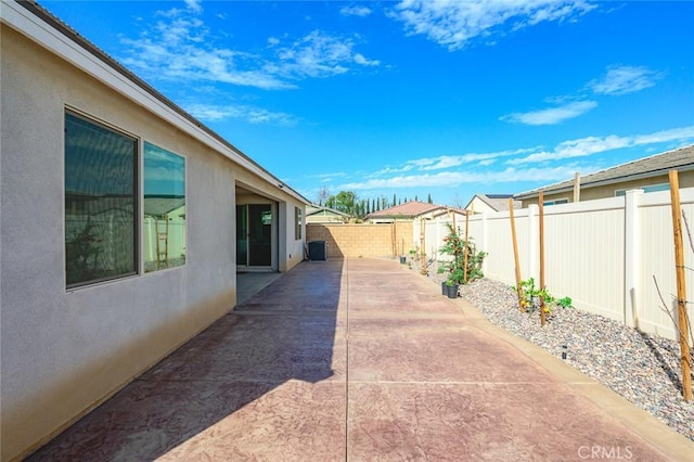 view of patio / terrace featuring a residential view and a fenced backyard