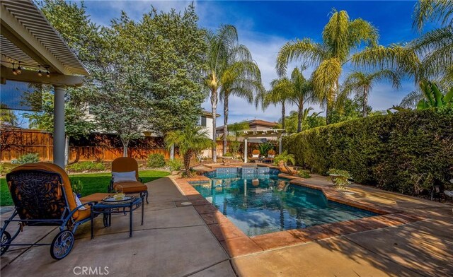 view of pool featuring a fenced in pool, a patio, and a fenced backyard