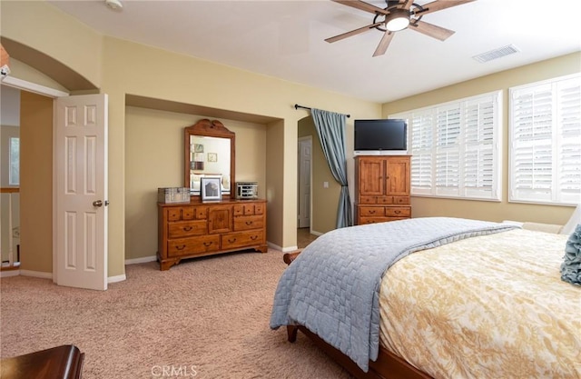 bedroom with visible vents, ceiling fan, baseboards, and carpet floors