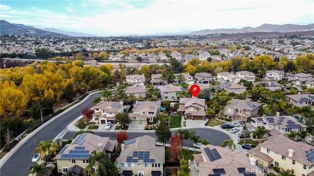 drone / aerial view featuring a mountain view and a residential view