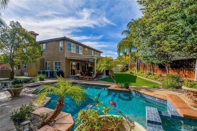 view of swimming pool featuring a fenced in pool, a yard, fence private yard, and a patio area