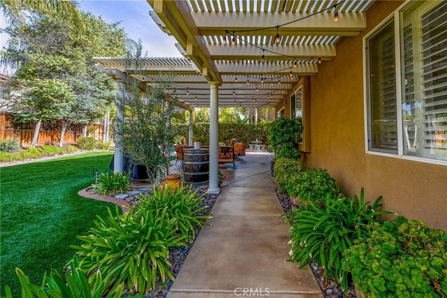 exterior space with a patio, a pergola, and fence