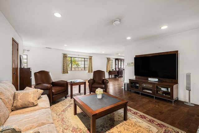 living room featuring recessed lighting, baseboards, and wood finished floors