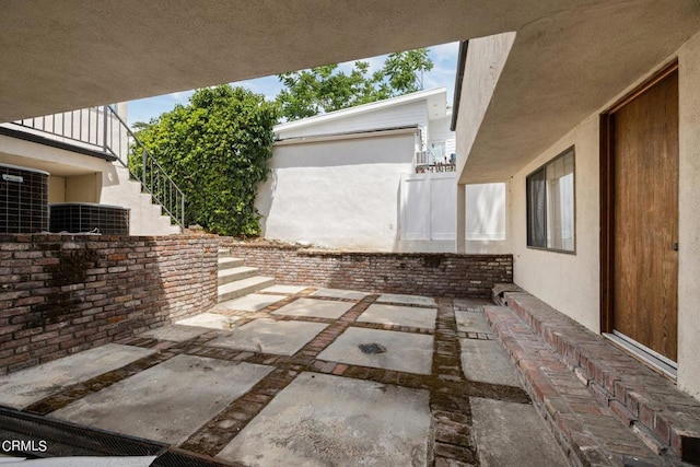 view of patio featuring fence