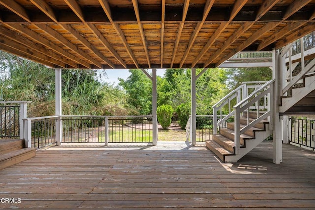 wooden terrace featuring stairs