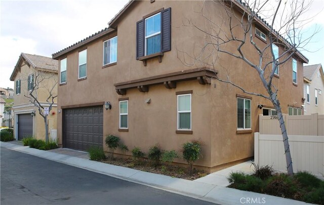 27464 Honeydew Ct, Saugus, CA 91350 - view of home's exterior featuring an attached garage and stucco siding