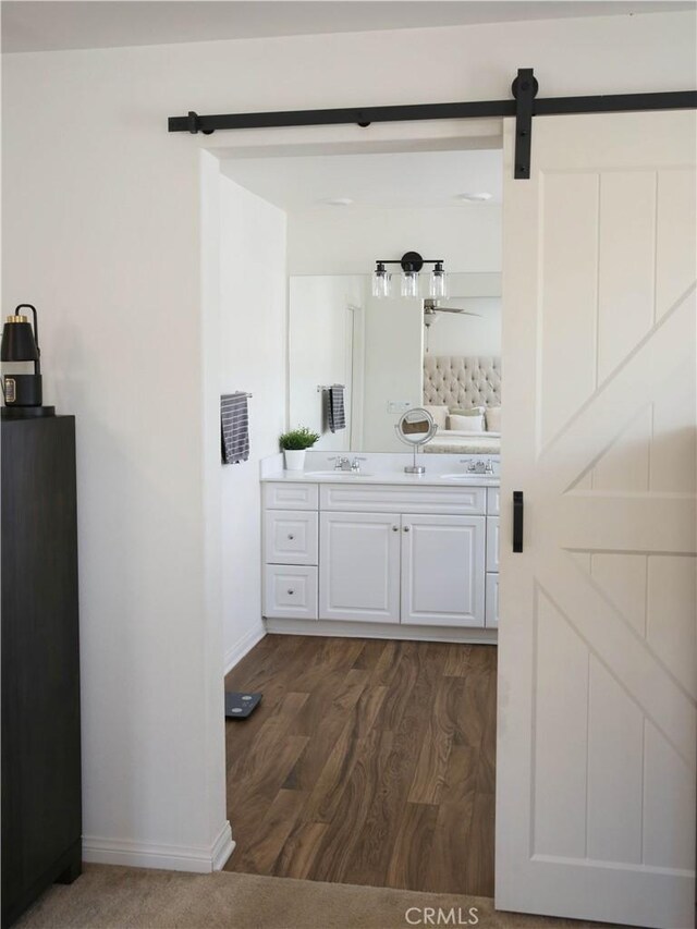 27464 Honeydew Ct, Saugus, CA 91350 - bathroom with baseboards, wood finished floors, and vanity