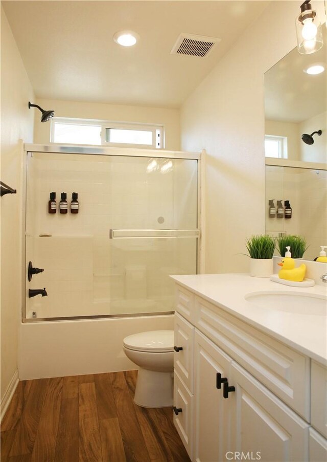 27464 Honeydew Ct, Saugus, CA 91350 - bathroom with vanity, toilet, plenty of natural light, wood finished floors, and recessed lighting